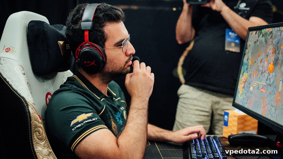 ATF сидит за компьютером во время профессионального матча по Dota 2